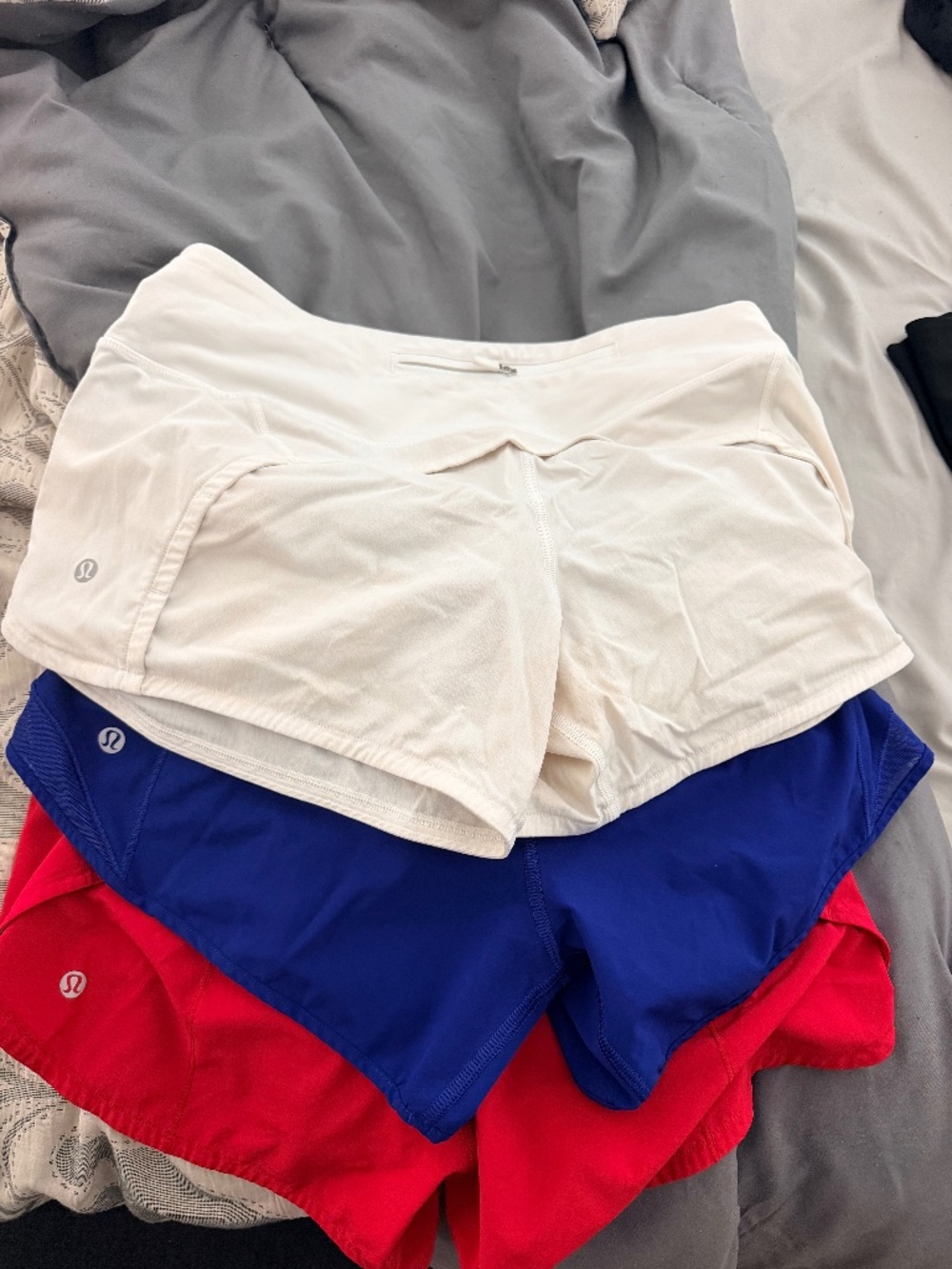 3 pairs of lululemon shorts (red, white and blue)